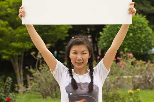 Portrait of a sexy young female smiling in a park - Outdoor