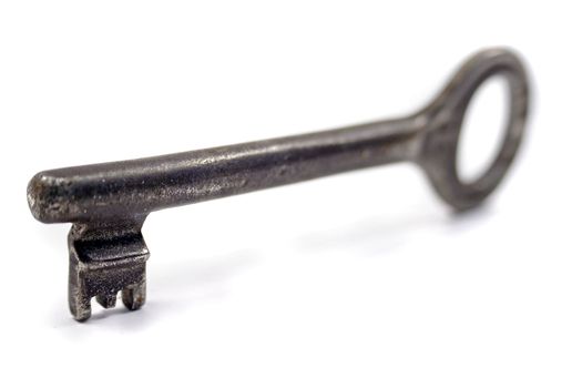 A close up of an old-fashioned metal key.