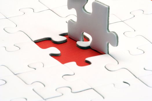 A typical jigsaw puzzle with a red gap.