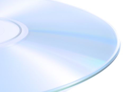 A closeup view of a light shiny compact disk used for data storage on a white background.