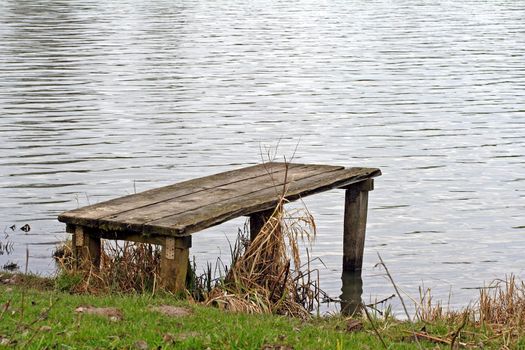 A small pier at the bank of a lake