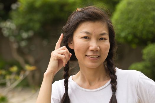 Portrait of a sexy young female smiling in a park - Outdoor