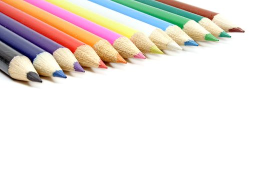 A line of colorful crayons. All isolated on white background.