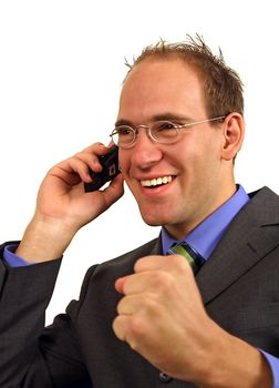 A smart businessman gets a surprising telephone call. All isolated on white background.