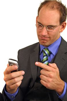 A smarting businessman gets bad news via his mobile phone. All isolated on white background.