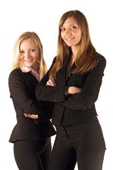 Two young business women reviewing documents. All isolated on white background.