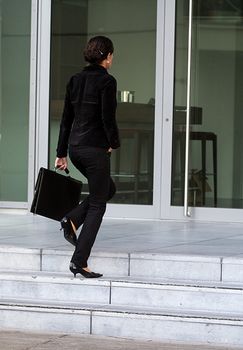 A young handsome woman on her way to work.