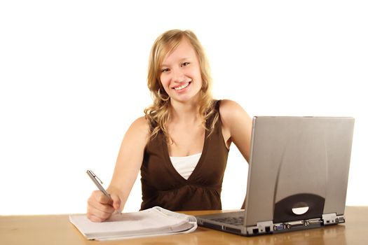 A young smarting woman at her workplace. All isolated on white background.