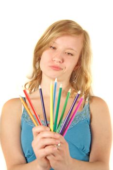 A young handsome woman chooses a colored crayon. All isolated on white background.