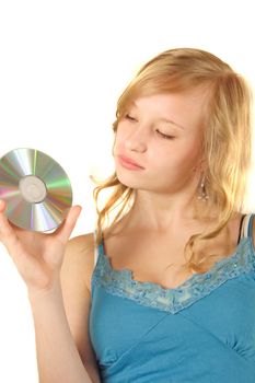 A young woman considering a cd or dvd. All isolated on white background.