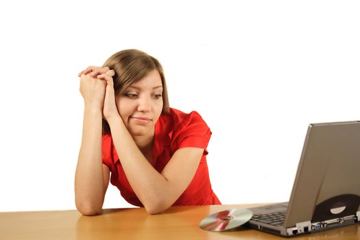 A young handsome student waiting for the installation process of her notebook computer. All isolated on white background.