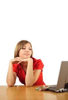 A young handsome student waiting for the installation process of her notebook computer. All isolated on white background.