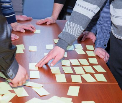 Students choose examination tickets. Many tickets on the table. editorial