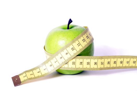 A metaphorical image showing an apple measured with a tape showing healthy diet on a white background.