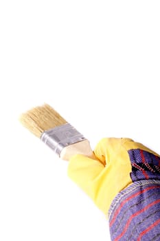 A hand in gauntlet painting a wall. All isolated on white background.