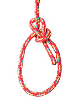 A fine knotted bowline in red in front of white background.