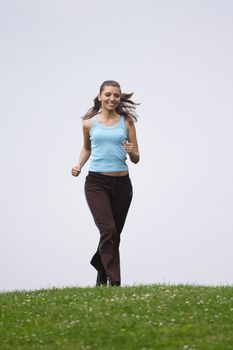 A handsome young woman running on a green meadow.
** Note: Slight blurriness, best at smaller sizes.