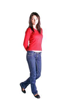 A young handsome woman standing in front of a white background.