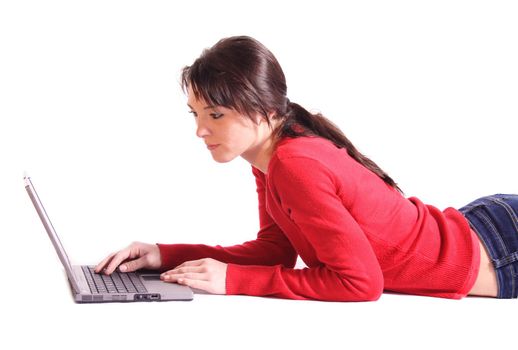 An attractive young woman using a notebook computer. All isolated on white background.