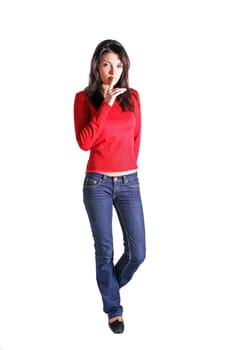 Full length shof of an attractive young woman asks for silence. All on white background.