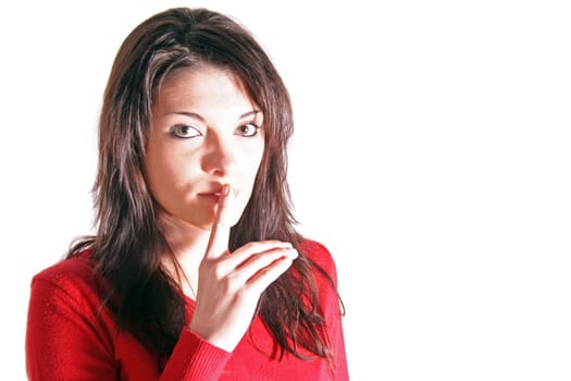 Attractive young woman asks for silence. All on white background.