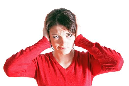 Attractive young woman keeping her ears shut. All on white background.