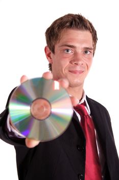 A smarting businessman holding a cd or dvd. All isolated on white background.