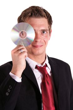 A smarting businessman holding a cd or dvd. All isolated on white background.