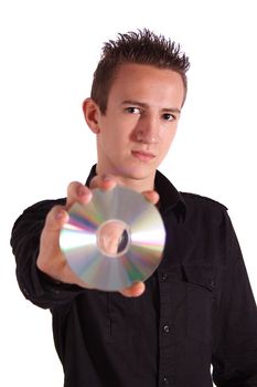 A young handsome man holding a cd or dvd. All isolated on white background.