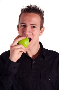 A young handsome man eating an apple. All isolated on white background.