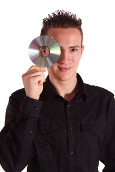 A young handsome man holding a cd or dvd. All isolated on white background.