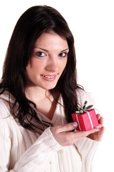 A handsome young woman holding a small red present. All isolated on white background.