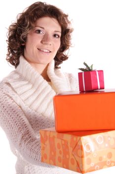 A handsome young woman holding a pile of fine wrapped presents. All isolated on white background.