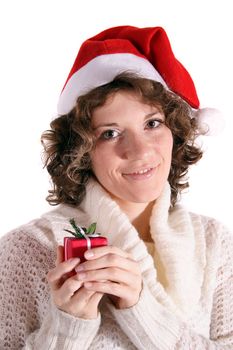 A handsome young woman holding a little Christmas present. All isolated on white background.