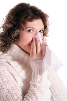 A handsome young woman got a cold. All isolated on white background.