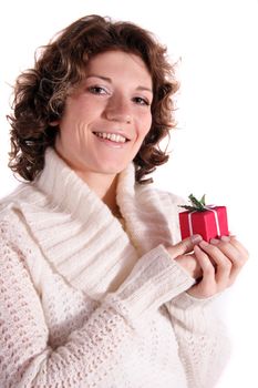 A handsome young woman holding a small red presents. All isolated on white background.