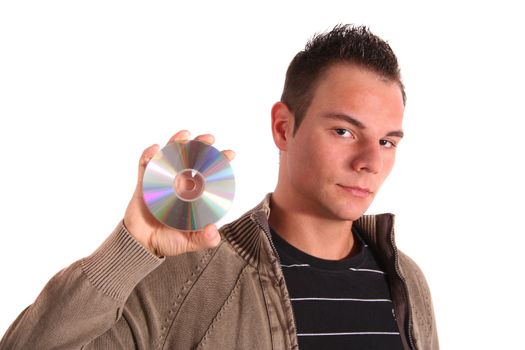 A handsome young man holding a cd or dvd. All isolated on white background.