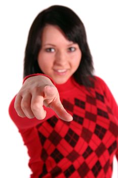 A handsome young woman points with her finger at someone or something. All isolated on white background.