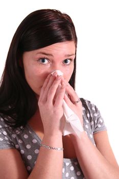 A handsome young woman got a flu. All isolated on white background.