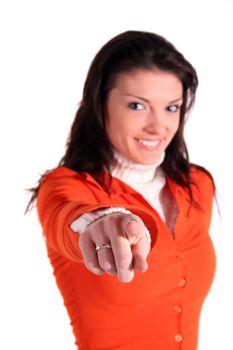 A handsome young woman points with her finger at someone or something. All isolated on white background.