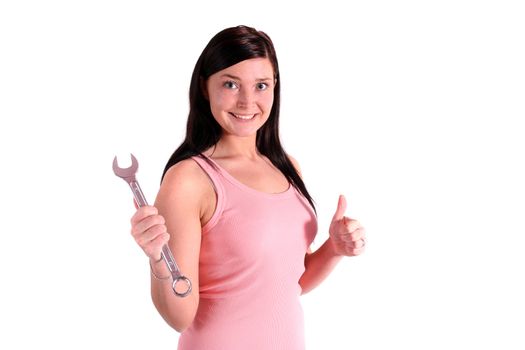 A handsome smiling woman holding a screw-wrench. All isolated on white background.