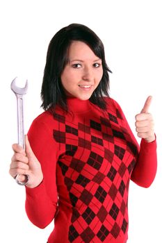 A handsome smiling woman holding a screw-wrench. All isolated on white background.