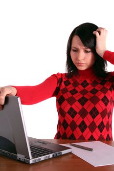 A young handsome woman got a problem with her notebook computer. All isolated on white background.