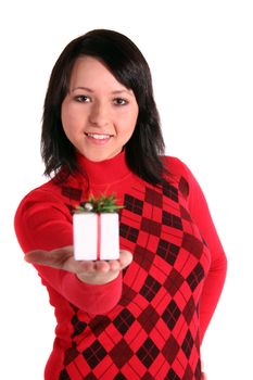 A young handsome woman handovers a small white present. All isolated on white background.