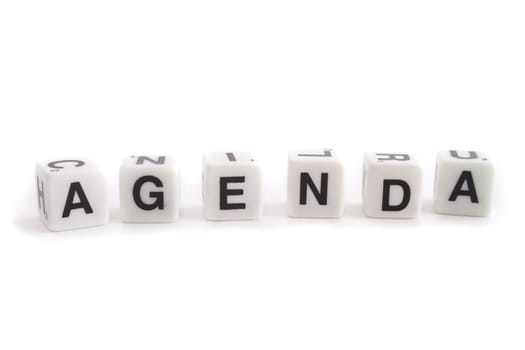 Several dices with characters show the word agenda. All isolated on white background.