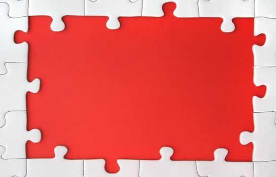 A jigsaw puzzle with a red gap.