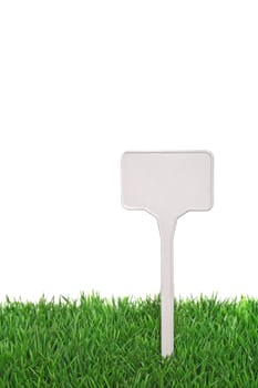 A sign-board in a nice green meadow. All on white background.