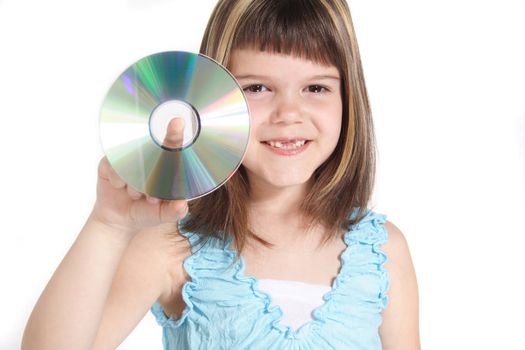 A young girl holding a cd or dvd. All isolated on white background.