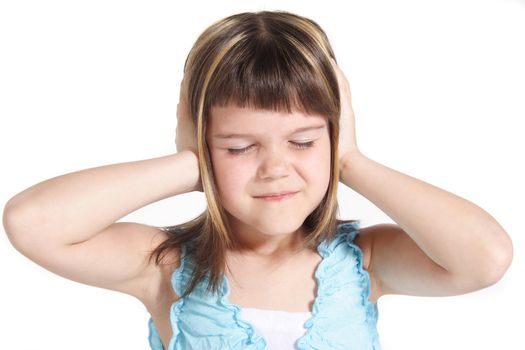 A young girl suffering from noise. All isolated on white background.