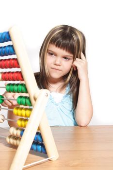 A young girl learning maths by using a sliding rule. All isolated on white background.